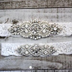 White lace bridal garter set with rhinestones.